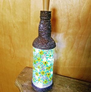 Cute wine bottle wrapped on top and bottom.